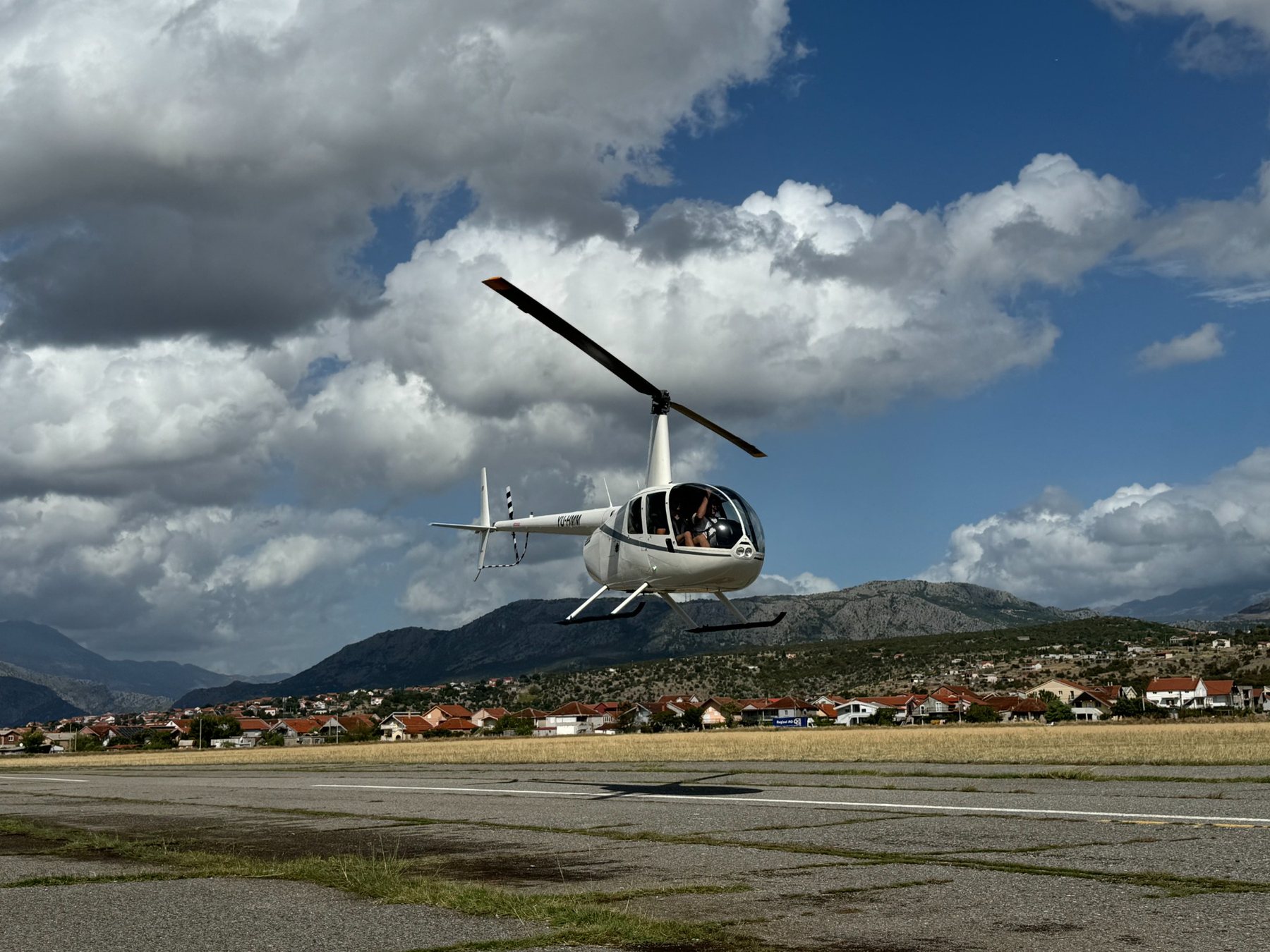 Robinson helicopter under dramatic clouds
