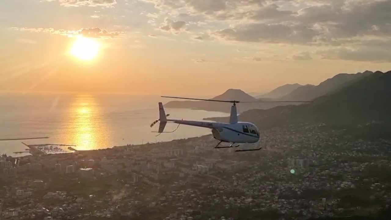 Helicopter sunset flight over the coast